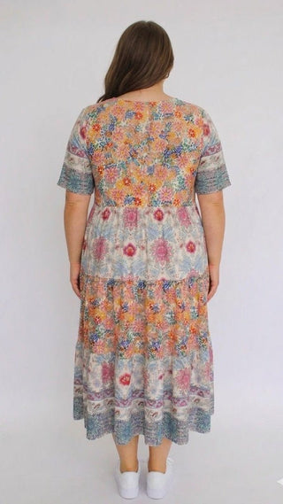 Woman wearing a floral dress on a white background